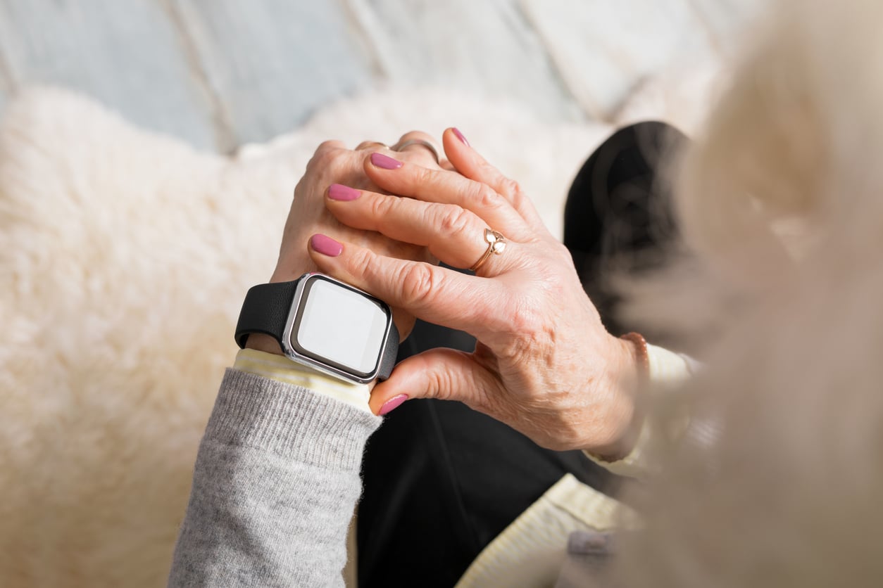 woman looking at smartwatch